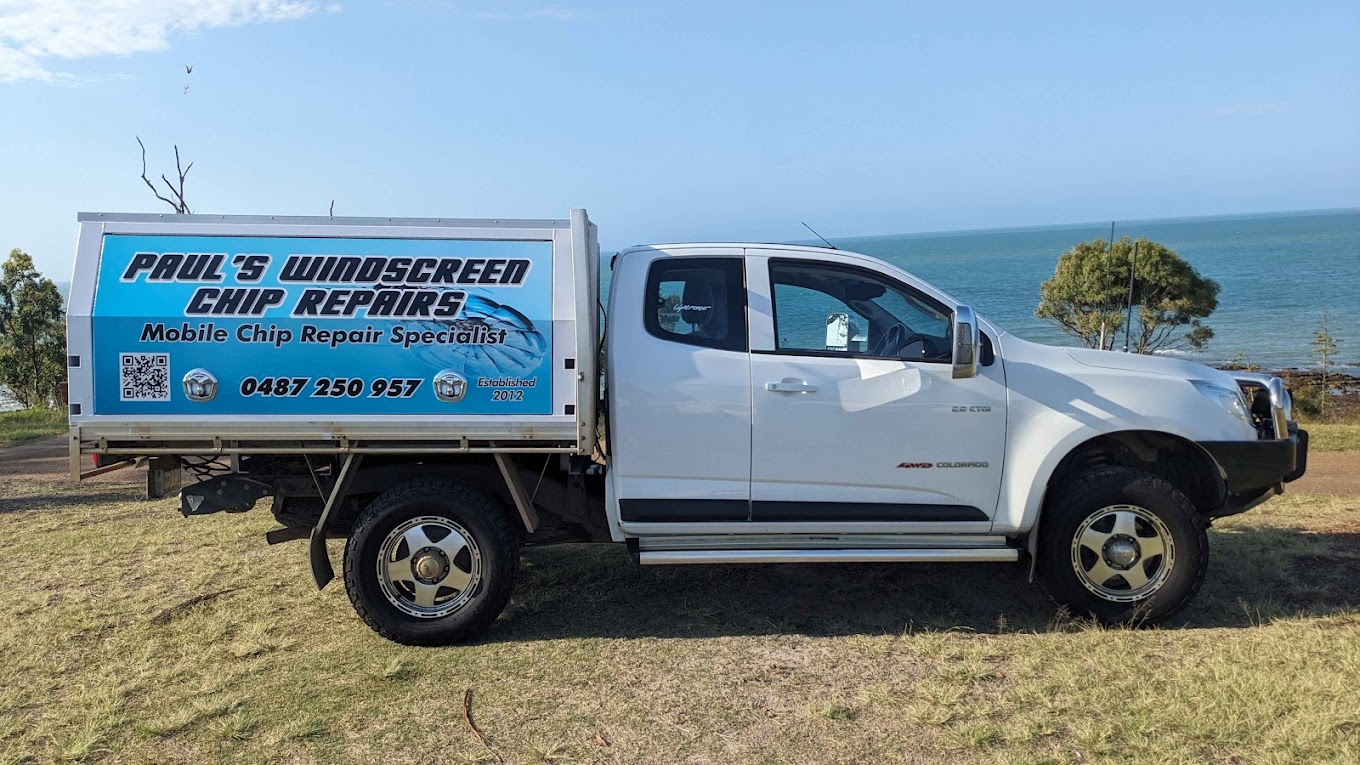 Paul’s signwritten mobile windscreen chip-repair vehicle beside the coast